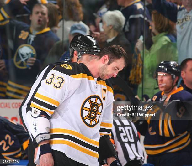 Zdeno Chara of the Boston Bruins leaves the ice after an altercation against the Buffalo Sabres in the closing seconds of Game Five of the Eastern...