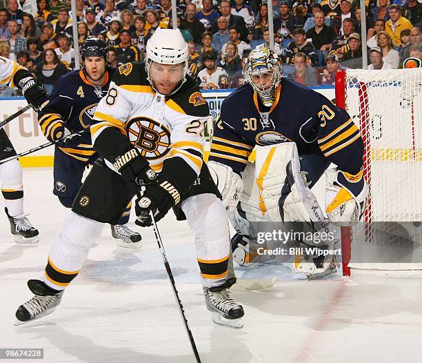 Mark Recchi of the Boston Bruins controls the puck in front of Ryan Miller of the Buffalo Sabres in Game Five of the Eastern Conference Quarterfinals...