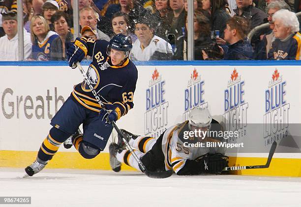Tyler Ennis of the Buffalo Sabres skates past Johnny Boychuk of the Boston Bruins in Game Five of the Eastern Conference Quarterfinals during the...