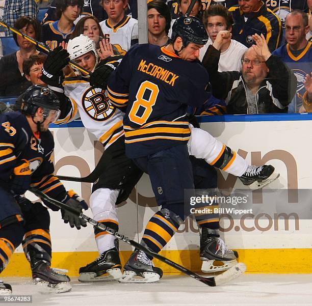 Cody McCormick of the Buffalo Sabres battles along the boards against the Boston Bruins in Game Five of the Eastern Conference Quarterfinals during...