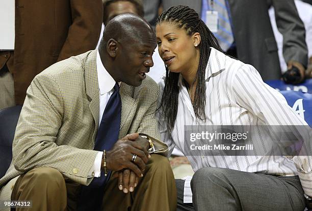 Charlotte Bobcats owner Michael Jordan talks with sideline reporter Cheryl Miller during Game Three of the Eastern Conference Quarterfinals between...