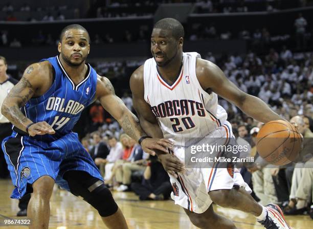 Guard Raymond Felton of the Charlotte Bobcats dribbles with the ball while guard Jameer Nelson of the Orlando Magic defends him during Game Three of...