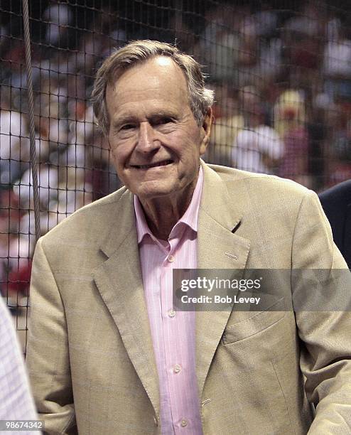 Former President George H.W. Bush meets some fans after attending the PIttsburgh Pirates and Houston Astros baeball game at Minute Maid Park on April...