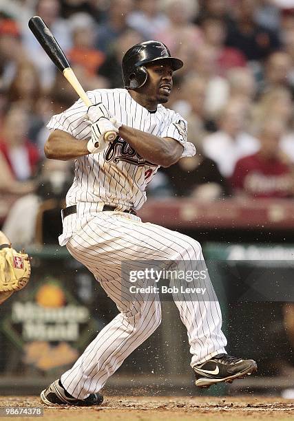 Michael Bourn of the Houston Astros singles on a ground ball to second baseman Akinori Iwamura of the Pittsburgh Pirates as the balll was deflected...