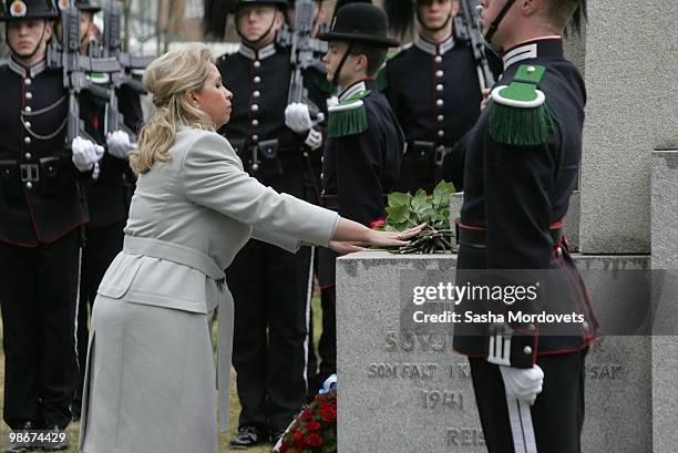 Svetlana Medvedeva, wife of Russian President Dmitry Medvedev, lays flowers at a memorial for Soviet troops who died in Norway during World War II on...