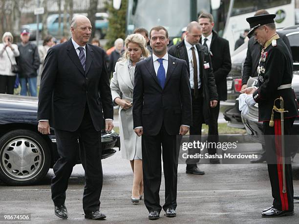 King Harald V of Norway accompanies Russian President Dmitry Medvedev and his wife Svetlana Medvedeva during a visit to a memorial for Soviet troops...