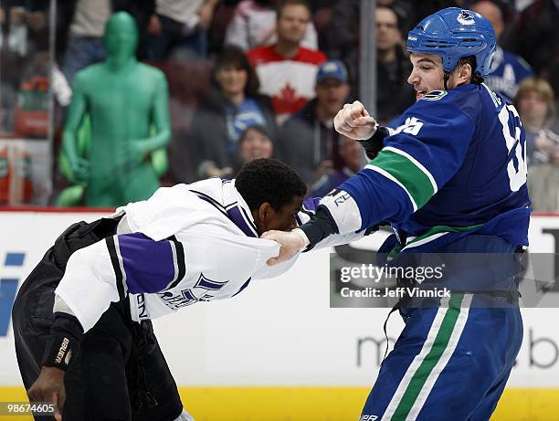 Shane O'Brien of the Vancouver Canucks and Wayne Simmonds of the Los Angeles Kings exchange punches as they fight in Game Five of the Western...