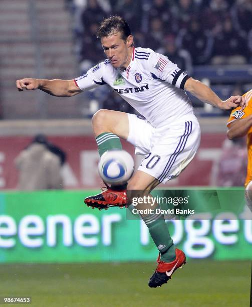 Brian McBride of the Chicago Fire lifts the ball against the Houston Dynamo in an MLS match on April 24, 2010 at Toyota Park in Brideview, Illinois....