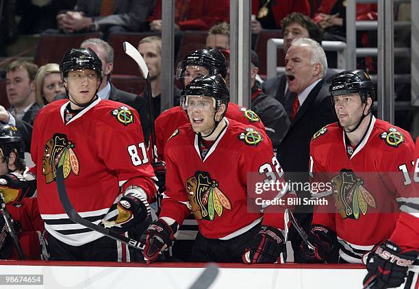 Kris Versteeg of the Chicago Blackhawks reacts to a call made against the Blackhawks, in between teammates Marian Hossa and John Madden at Game Two...