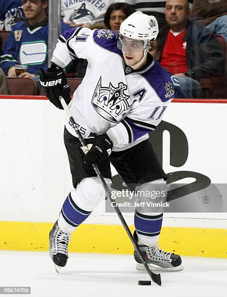 Anze Kopitar of the Los Angeles Kings skates up ice with the puck in Game Five of the Western Conference Quarterfinals in their game against the...