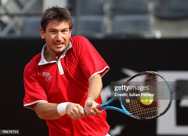Jan Hajek of Czech Republic plays a backhand in his match against Potito Starace of Italy during day two of the ATP Masters Series - Rome at the Foro...