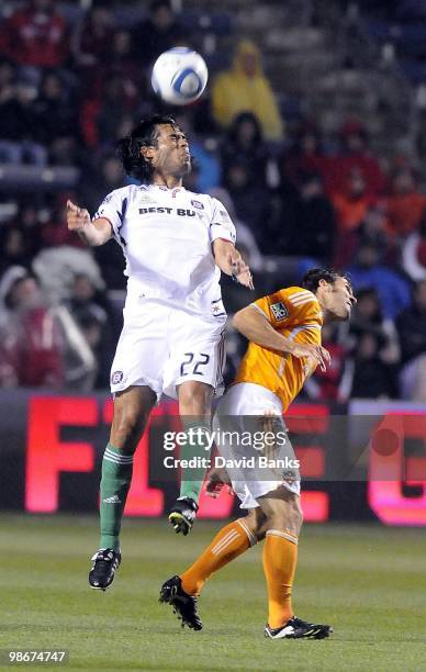 Wilman Conde of the Chicago Fire heads the ball as Brian Mullan of the Houston Dynamo defends in an MLS match on April 24, 2010 at Toyota Park in...