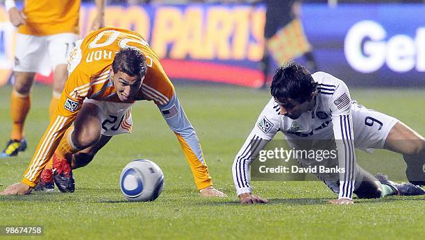 Baggio Husidic of the Chicago Fire and Geoff Cameron of the Houston Dynamo go for the ball in an MLS match on April 24, 2010 at Toyota Park in...