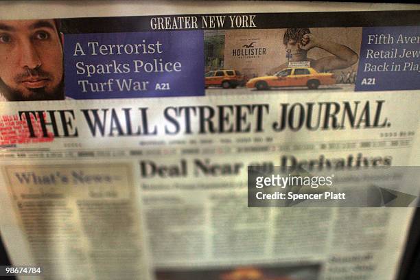An issue of The Wall Street Journal is viewed in a vending machine on April 26, 2010 in New York City. The Wall Street Journal commenced a New York...