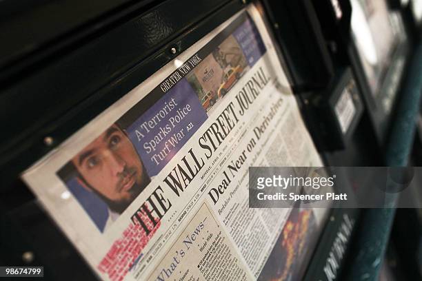 An issue of The Wall Street Journal is viewed in a vending machine on April 26, 2010 in New York City. The Wall Street Journal commenced a New York...
