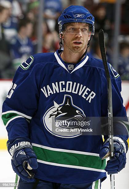 Mikael Samuelsson of the Vancouver Canucks looks on from the bench in Game Five of the Western Conference Quarterfinals in their game against the Los...