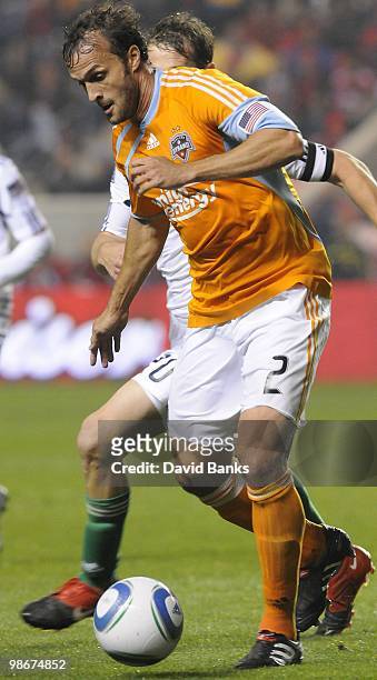 Eddie Robinson of the Houston Dynamo moves the ball forward against the Chicago Fire in an MLS match on April 24, 2010 at Toyota Park in Brideview,...