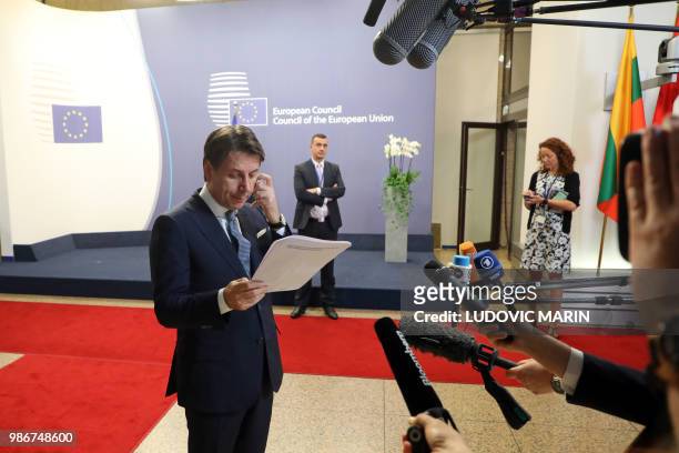 Italian prime minister Giuseppe Conte speaks to press before leaving the first day of the European Council leaders' summit focused on migration,...