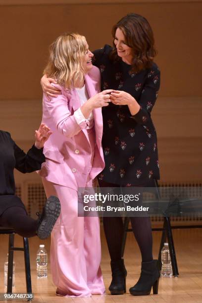 Amy Poehler and Tina Fey perform onstage during ASSSSCAT with the Upright Citizens Brigade Live at Carnegie Hall celebrating the 20th Anniversary of...