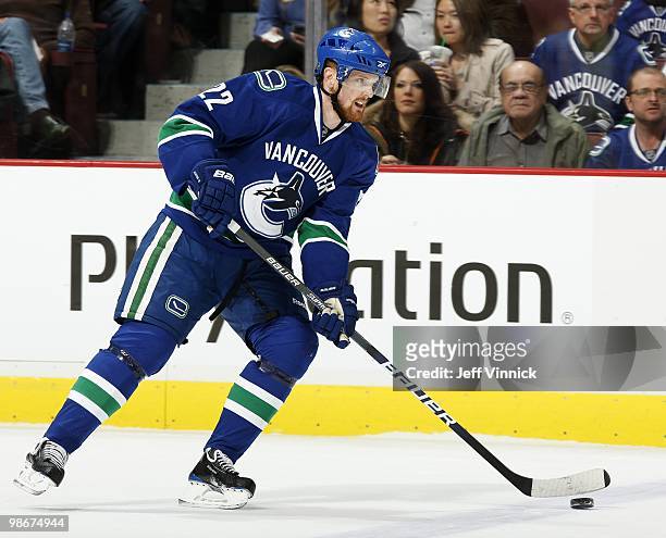 Daniel Sedin of the Vancouver Canucks skates up ice with the puck in Game Five of the Western Conference Quarterfinals in their game against the Los...