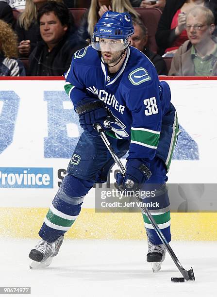 Pavol Demitra of the Vancouver Canucks skates up ice with the puck in Game Five of the Western Conference Quarterfinals in their game against the Los...