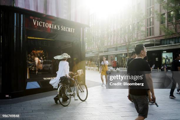 Pedestrian walk past a Victoria's Secret Stores LLC store on Wangfujing Street in Beijing, China, on Wednesday, June 27, 2018. Consumer sentiment in...