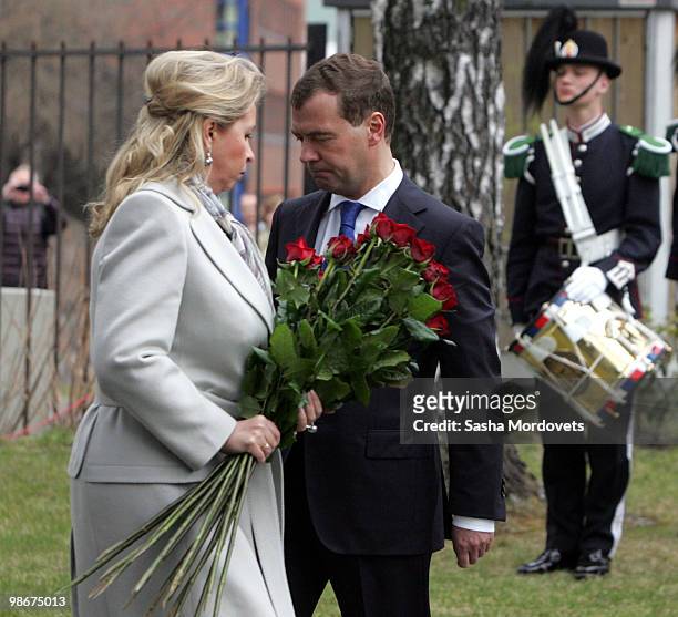 Russian President Dmitry Medvedev and his wife Svetlana Medvedeva lay flowers at a memorial for Soviet troops who died in Norway during World War II...