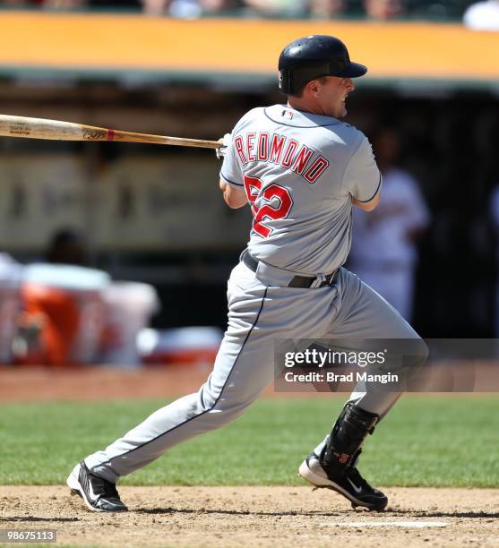 Mike Redmond of the Cleveland Indians bats against the Oakland Athletics during the game at Oakland-Alameda County Coliseum on April 24, 2010 in...
