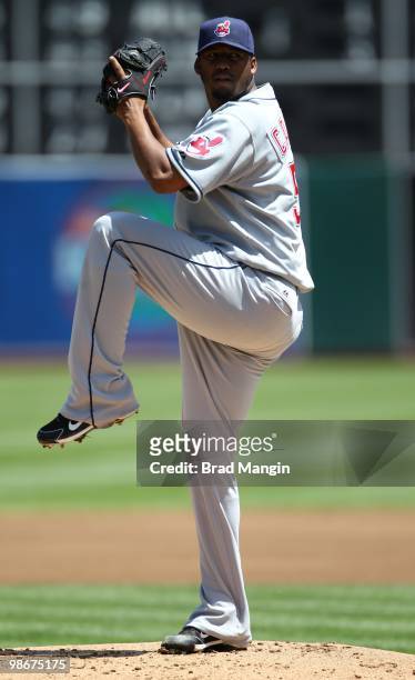 Fausto Carmona of the Cleveland Indians pitches against the Oakland Athletics during the game at Oakland-Alameda County Coliseum on April 24, 2010 in...