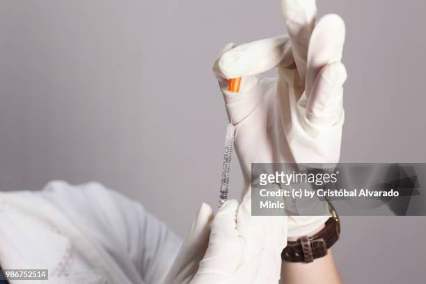 aesthetic doctor preparing syringe - carabobo ストックフォトと画像