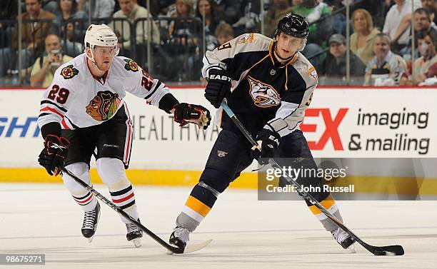 Marcel Goc of the Nashville Predators skates against Bryan Bickell of the Chicago Blackhawks in Game Four of the Western Conference Quarterfinals...