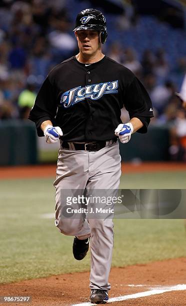Infielder Aaron Hill of the Toronto Blue Jays scores against the Tampa Bay Rays during the game at Tropicana Field on April 23, 2010 in St....