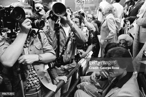 Actor Warren Beatty attempts to hide from the media during the 1976 New York, New York, Democratic National Convention at Madison Square Gardens.