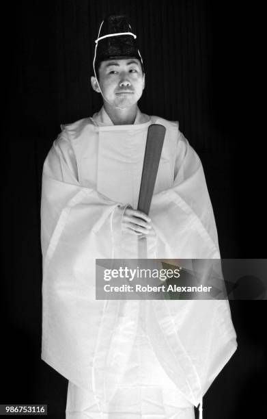 Shinto priest stands during a ceremony at the Meji-Jingu shrine in Tokyo, Japan.