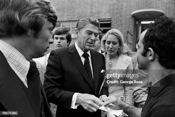 Presidential candidate Ronald Reagan signs autographs after a speech as seen in this 1976 Los Angeles, California, photo leading up to the Republican...