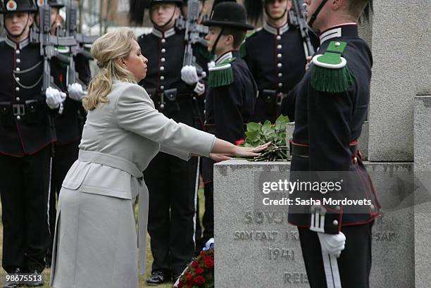 Svetlana Medvedeva, wife of Russian President Dmitry Medvedev, lays flowers at a memorial for Soviet troops who died in Norway during World War II on...