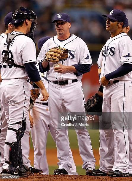 Relief pitcher Randy Choate of the Tampa Bay Rays meets with the infield against the Toronto Blue Jays during the game at Tropicana Field on April...