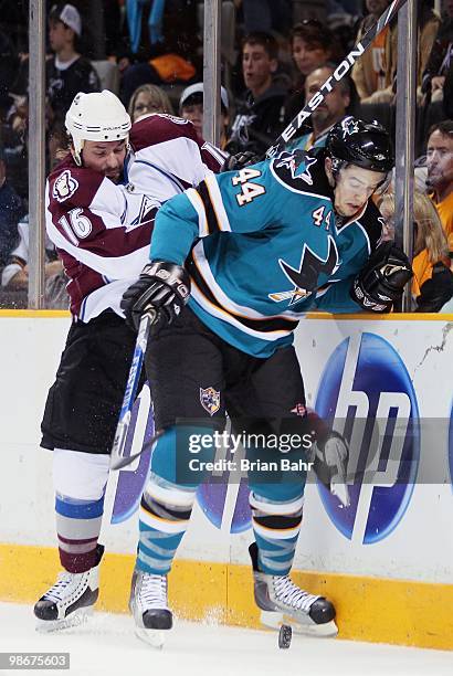 Darcy Tucker of the Colorado Avalanche and Marc-Edouard Vlasic of the San Jose Sharks scuffle for control of the puck in Game Five of their Western...