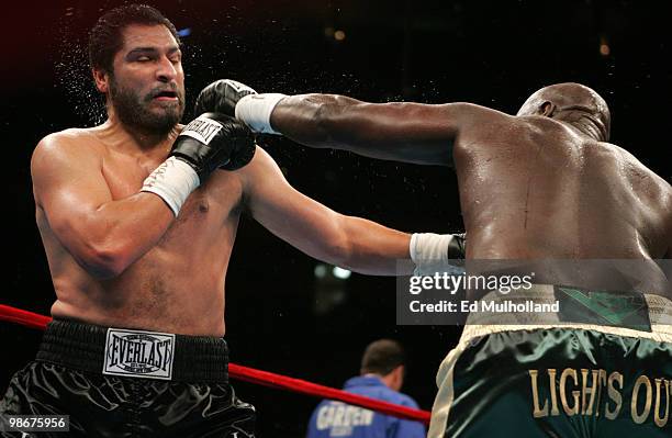 Champion John "The Quietman" Ruiz and challenger James "Lights Out" Toney trade punches during their WBA Heavyweight fight at Madison Square Garden....