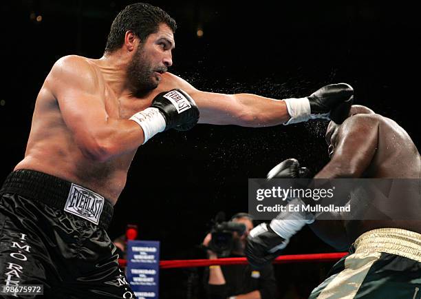 Champion John "The Quietman" Ruiz and challenger James "Lights Out" Toney trade punches during their WBA Heavyweight fight at Madison Square Garden....