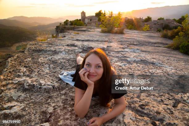 happy russian woman on the top of viewpoint during sunset in the catalan mountains. - debat fotografías e imágenes de stock