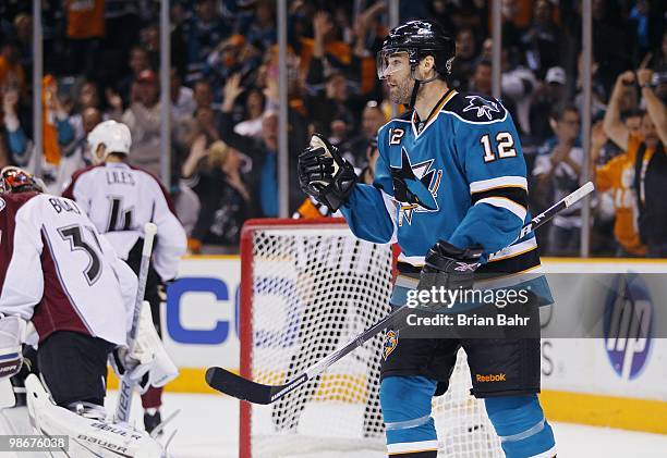 Patrick Marleau of the San Jose Sharks celebrates a goal against goalie Peter Budaj of the Colorado Avalanche in the third period of Game Five of...