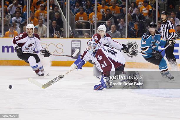 Goalie Craig Anderson of the Colorado Avalanche stretches to clear the puck against the San Jose Sharks in Game Five of their Western Conference...