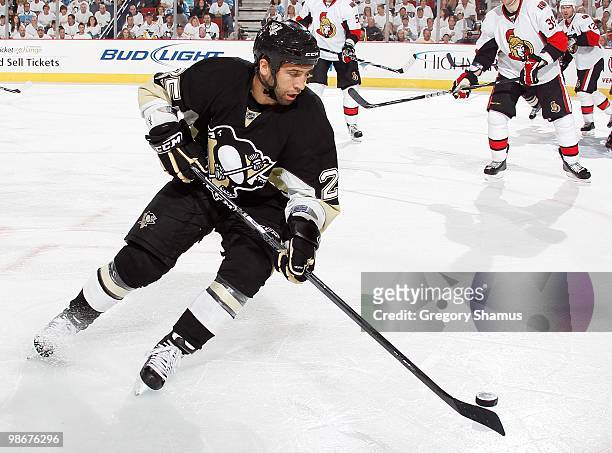 Maxime Talbot of the Pittsburgh Penguins moves the puck against the Ottawa Senators in Game Five of the Eastern Conference Quaterfinals during the...