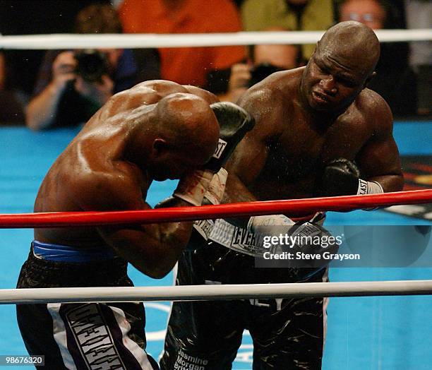 James Toney lands a punch to the head of Evander Holyfield in the ninth round. Seconds later Holyfield's corner threw in the towel fearing he would...