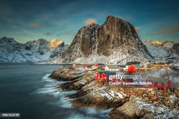 buildings on stilts by the sea in lofoten, norway. - lofoten bildbanksfoton och bilder