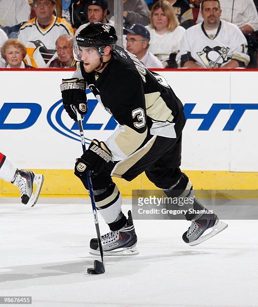 Alex Goligoski of the Pittsburgh Penguins moves the puck up ice against the Ottawa Senators in Game Five of the Eastern Conference Quaterfinals...