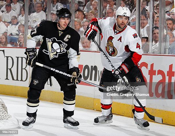 Sidney Crosby of the Pittsburgh Penguins skates alongside Chris Phillips of the Ottawa Senators in Game Five of the Eastern Conference Quaterfinals...