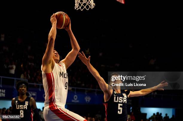 Francisco Cruz of Mexico drives to the basket against David Stockton of USA during the match between Mexico and USA as part of the FIBA World Cup...