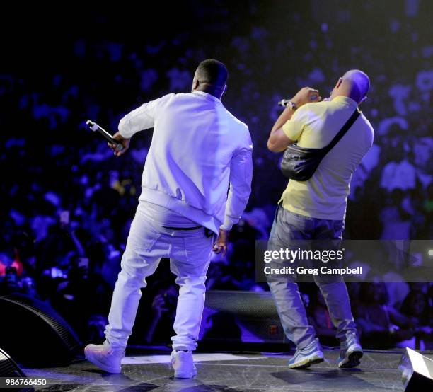 Yo Gotti and T.I. Perform onstage during the 6th Yo Gotti Birthday Bash at FedExForum on June 28, 2018 in Memphis, Tennessee.